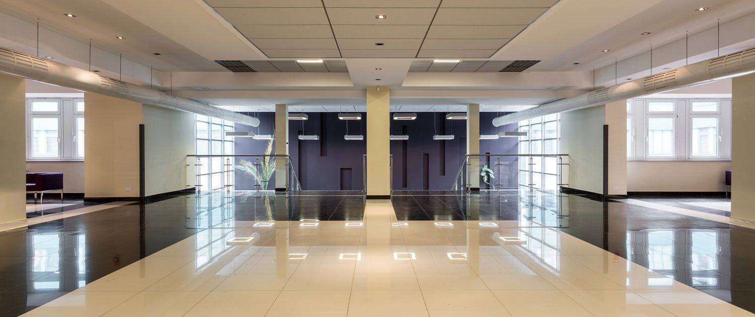 A converted office space with glossy floor tiles.